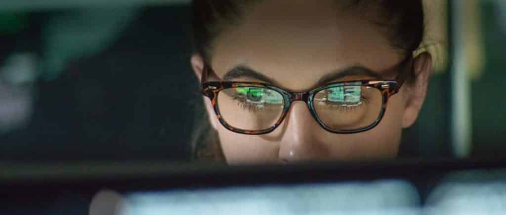 Photo of a woman looking at a computer screen to represent trend analysis for injury law firms