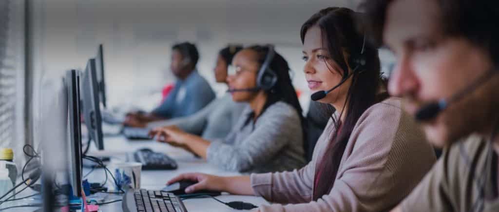 Photo of call center employees doing call handling for injury law firms