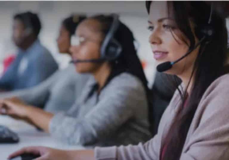 Photo of call center employees doing call handling for injury law firms