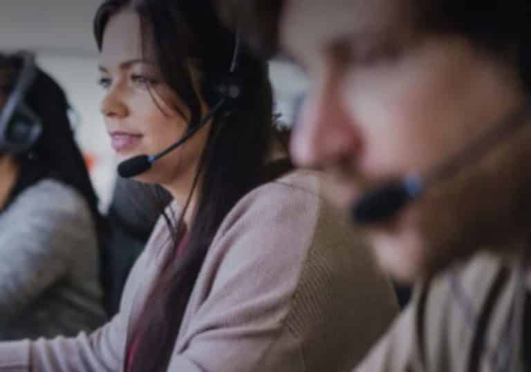 Photo of a woman with a headset to represent contract processing for law firms